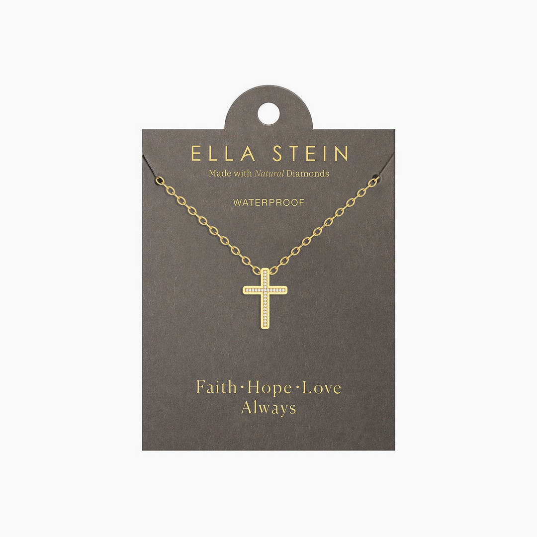 Gold-plated cross pendant necklace with natural diamonds on a grey display card.