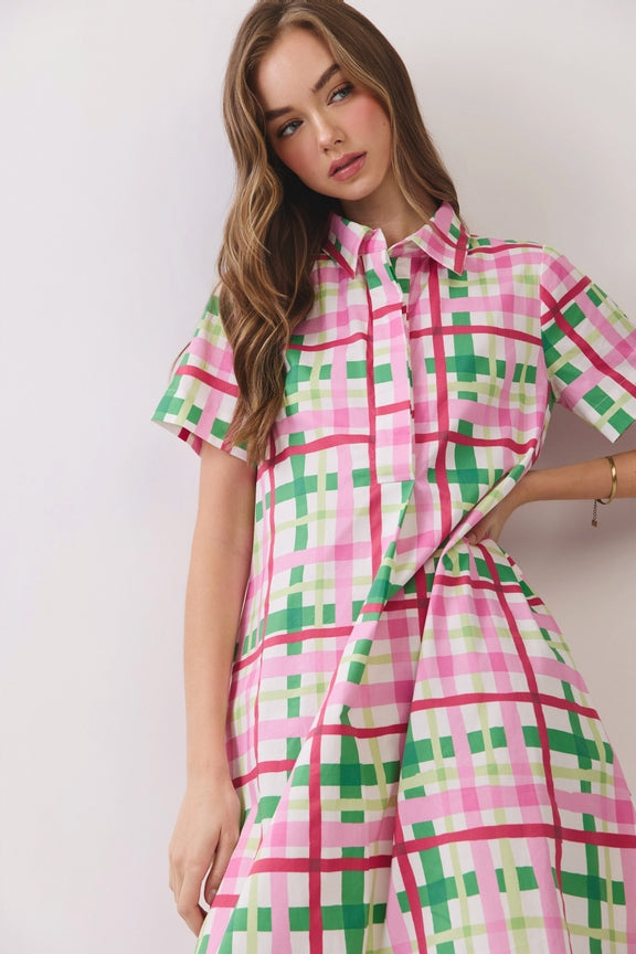 Woman wearing the Amara Plaid Button Down Midi Dress in a pink and green plaid pattern.
