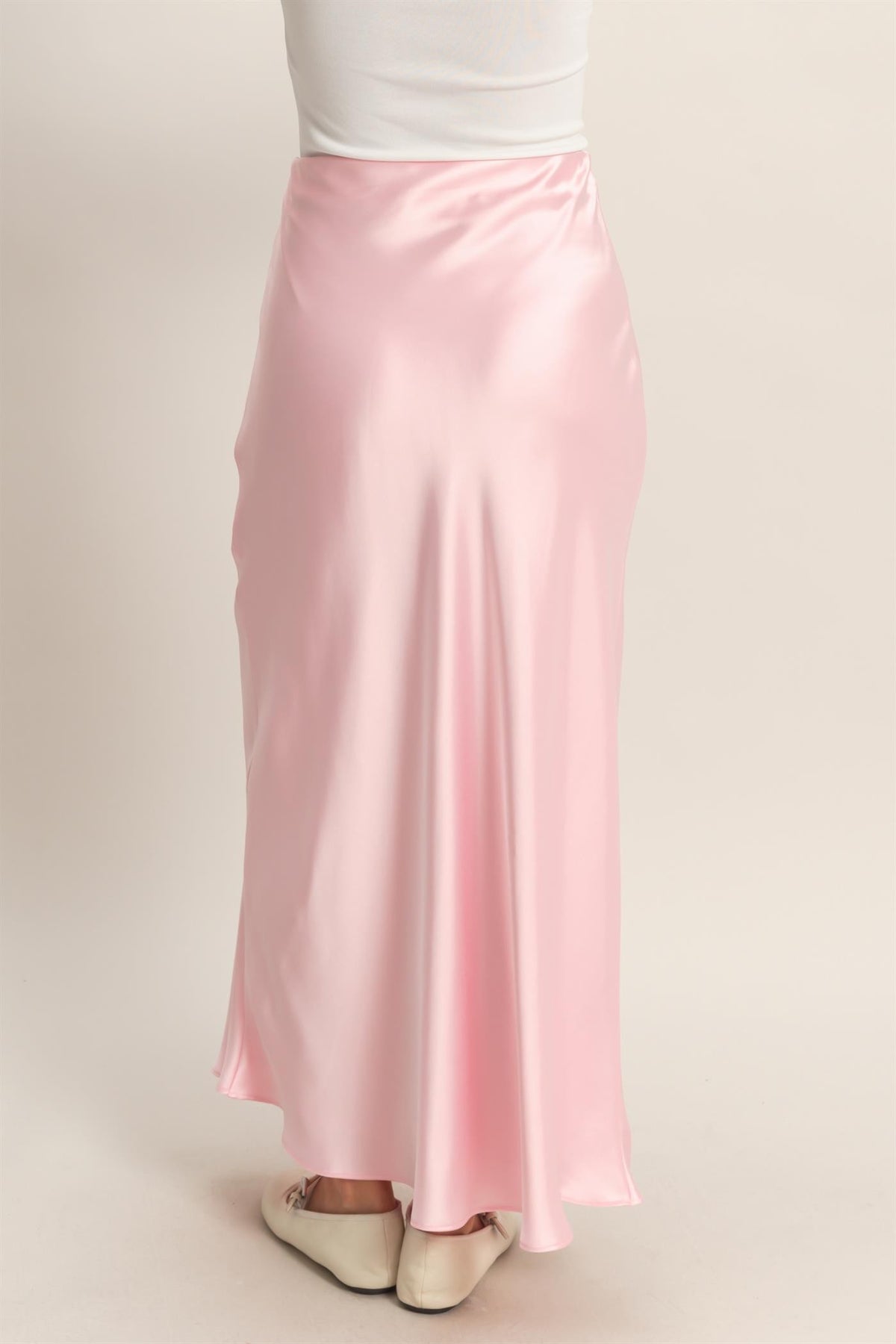 Black bias-draped satin maxi skirt with flowing A-line silhouette.