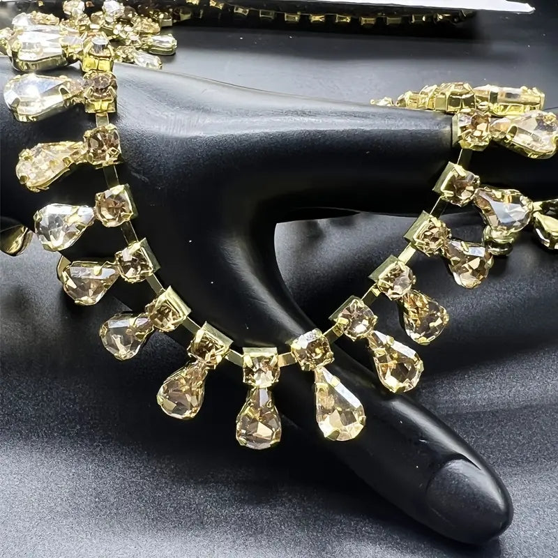 Golden-tone glass rhinestone chain with teardrop pendants