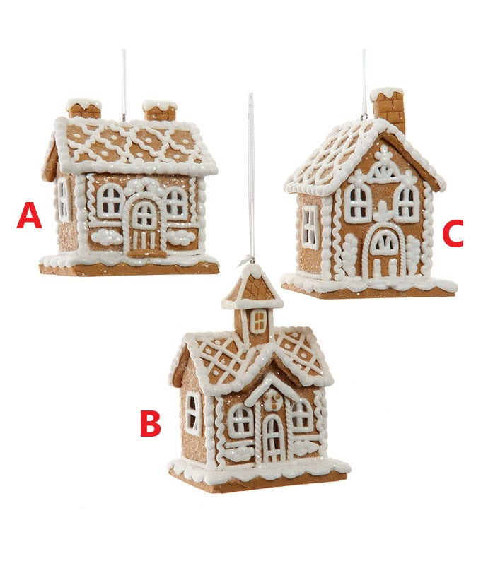 4-inch gingerbread house ornament made from claydough with a festive red roof and white icing details.