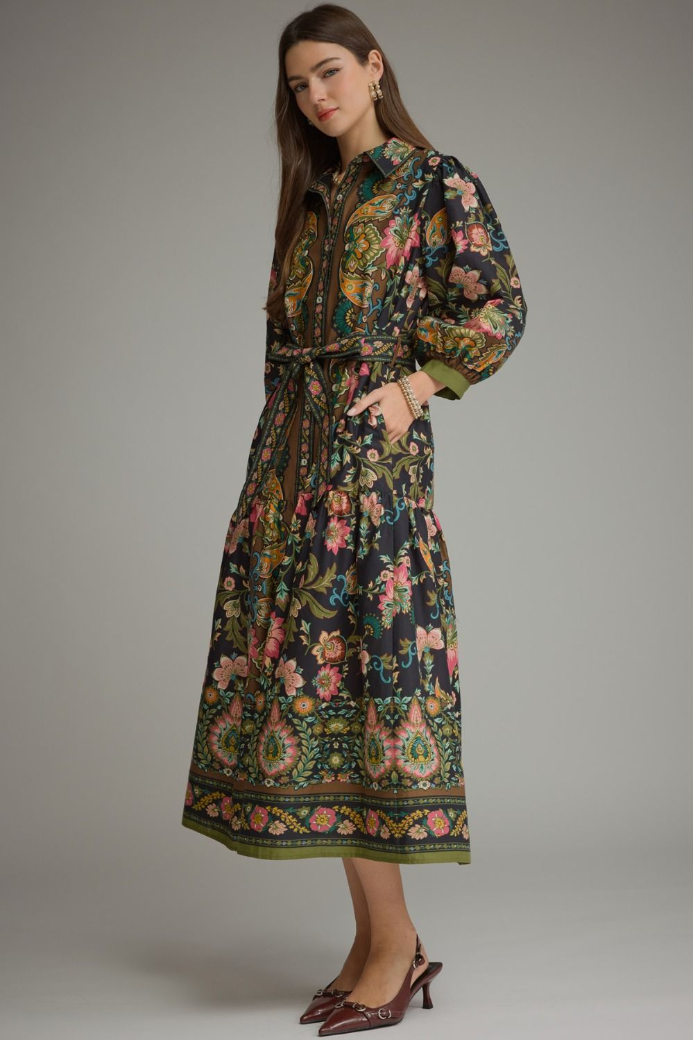Woman wearing the Chloe Printed ¾ Balloon Sleeve Midi Dress with a floral pattern and waist tie.