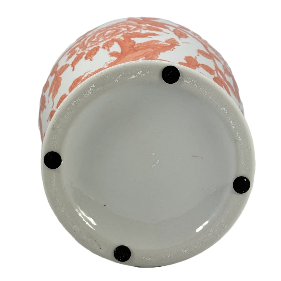 Tall orange ceramic ginger jar with white lotus chinoiserie pattern