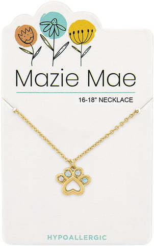 Gold Mazie Mae necklace with a paw print pendant featuring small blue stones on a display card.
