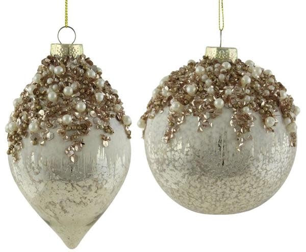 Clear glass spherical ornament with intricate cut detailing.