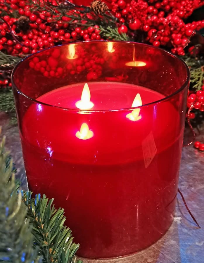 Glass candle holder with three vertical stems in clear glass