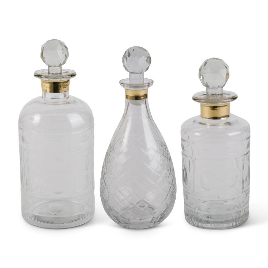 Clear glass decanter with gold rim trim
