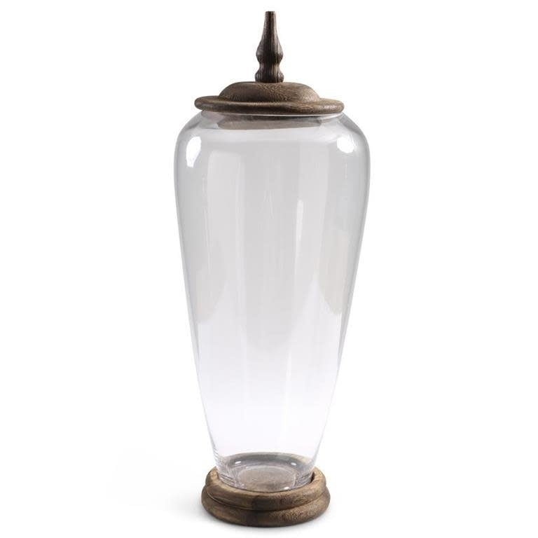Tall glass jar with wood base and lid in natural tones