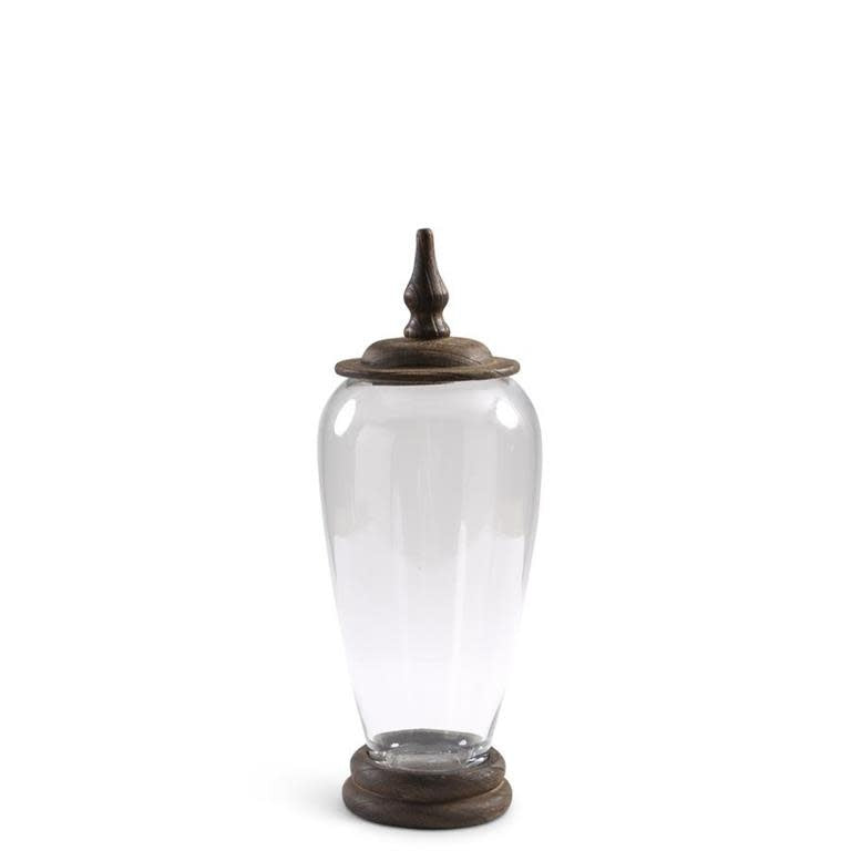 Tall glass jar with wood base and lid in natural tones