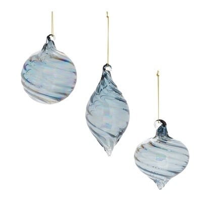 Clear glass Christmas ornament with intricate cut detailing and a shimmering finish.