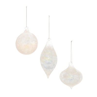 Clear glass Christmas ornament with intricate cut detailing.