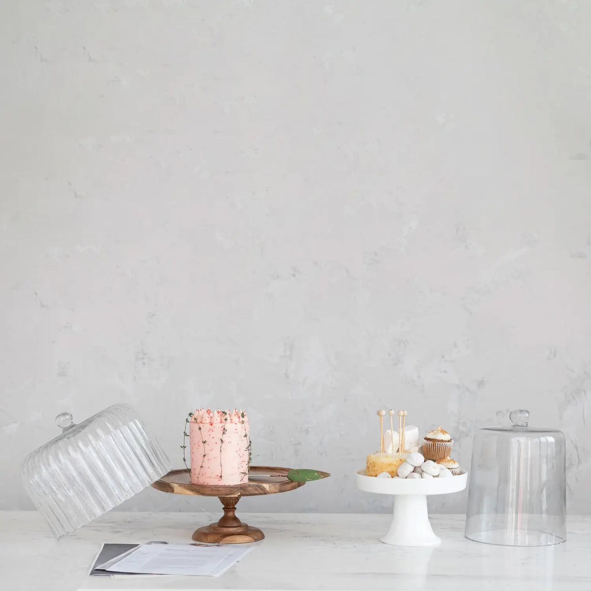 Glass pedestal cake stand with clear cloche dome