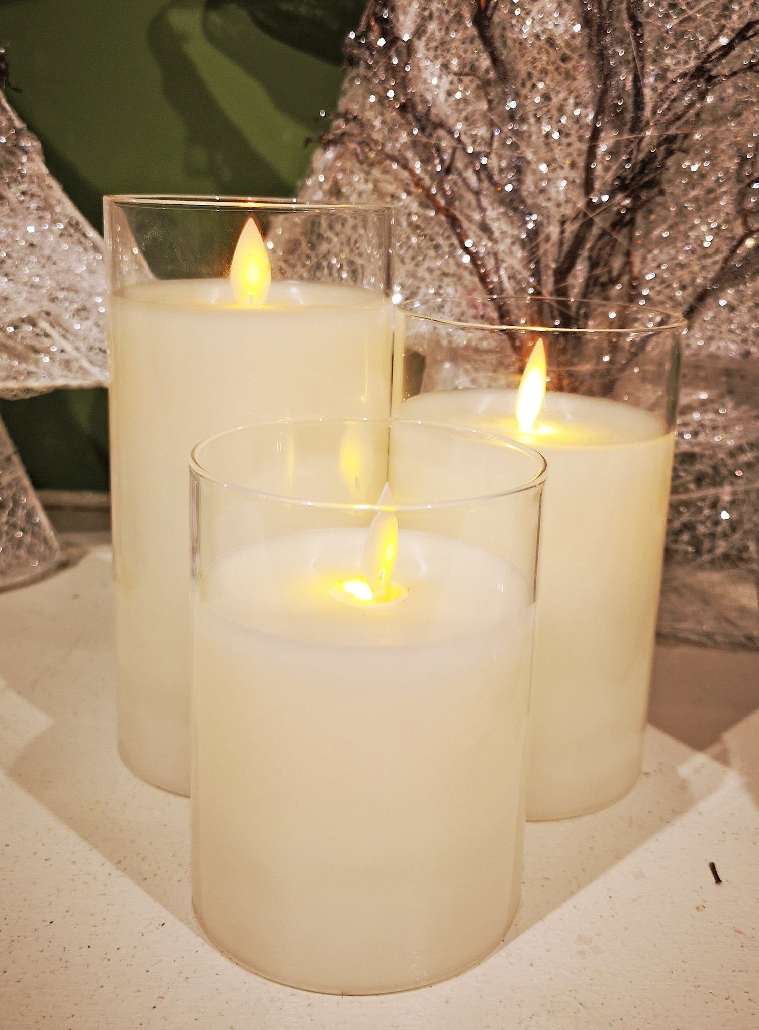 Clear glass pillar candle holder with a sleek cylindrical shape.