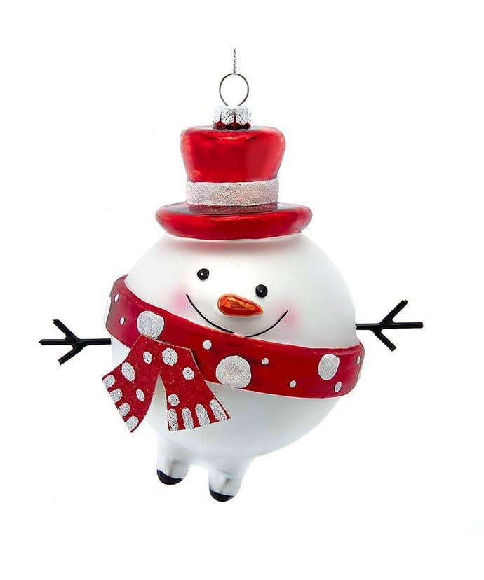 Glass snowman ornament with red and white face, wearing a silver glitter top hat and scarf.