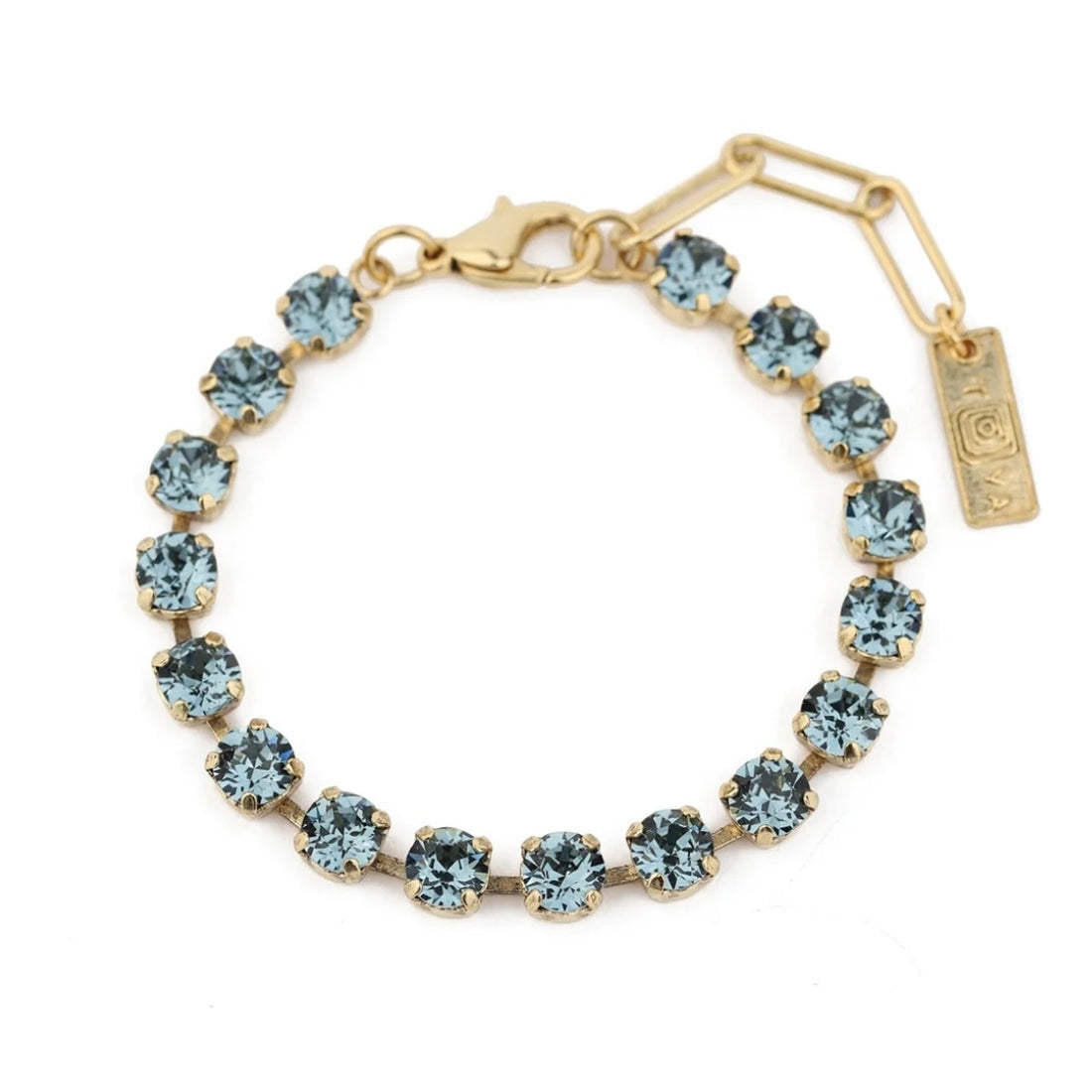 Sarina Bracelet featuring light blue crystals in antique gold-plated brass settings.