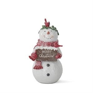 White polyresin snowwoman figurine with glitter accents on a tabletop.