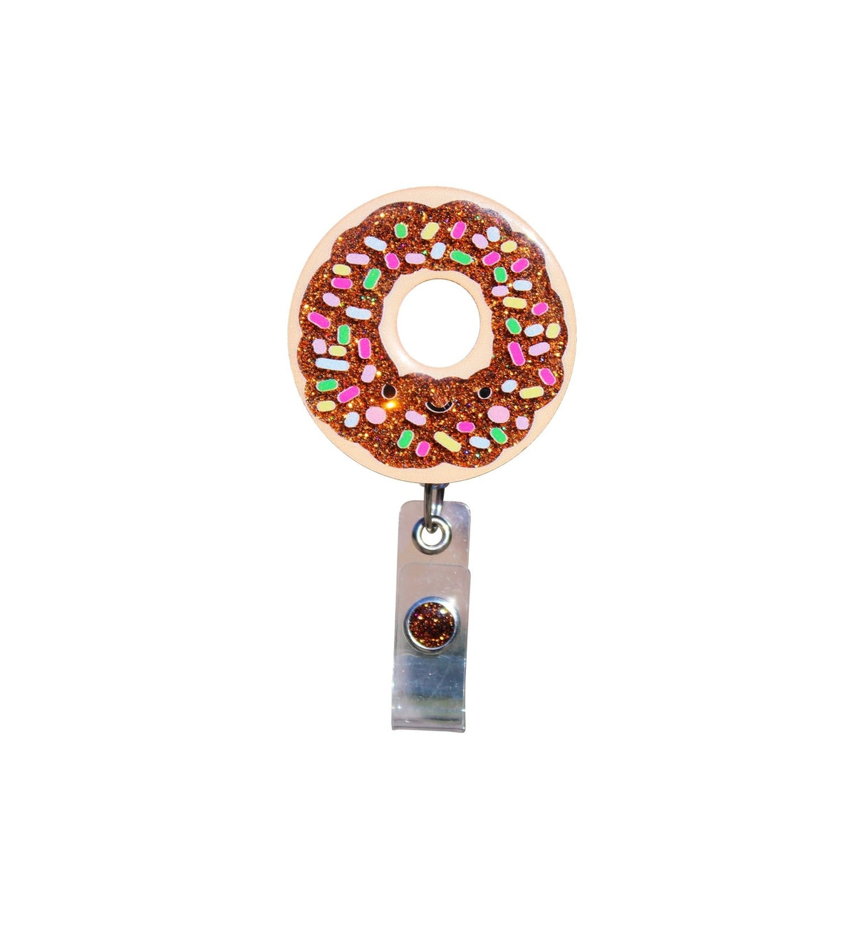 Glitterific badge reel with a donut-shaped glitter resin pin on an alligator clip.