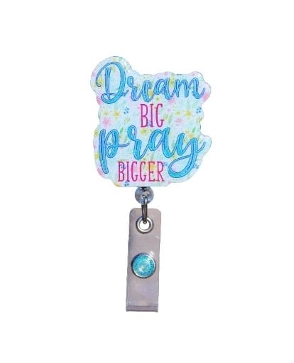Glitterific badge reel with dream big pray big glitter resin design on a spinning alligator clip