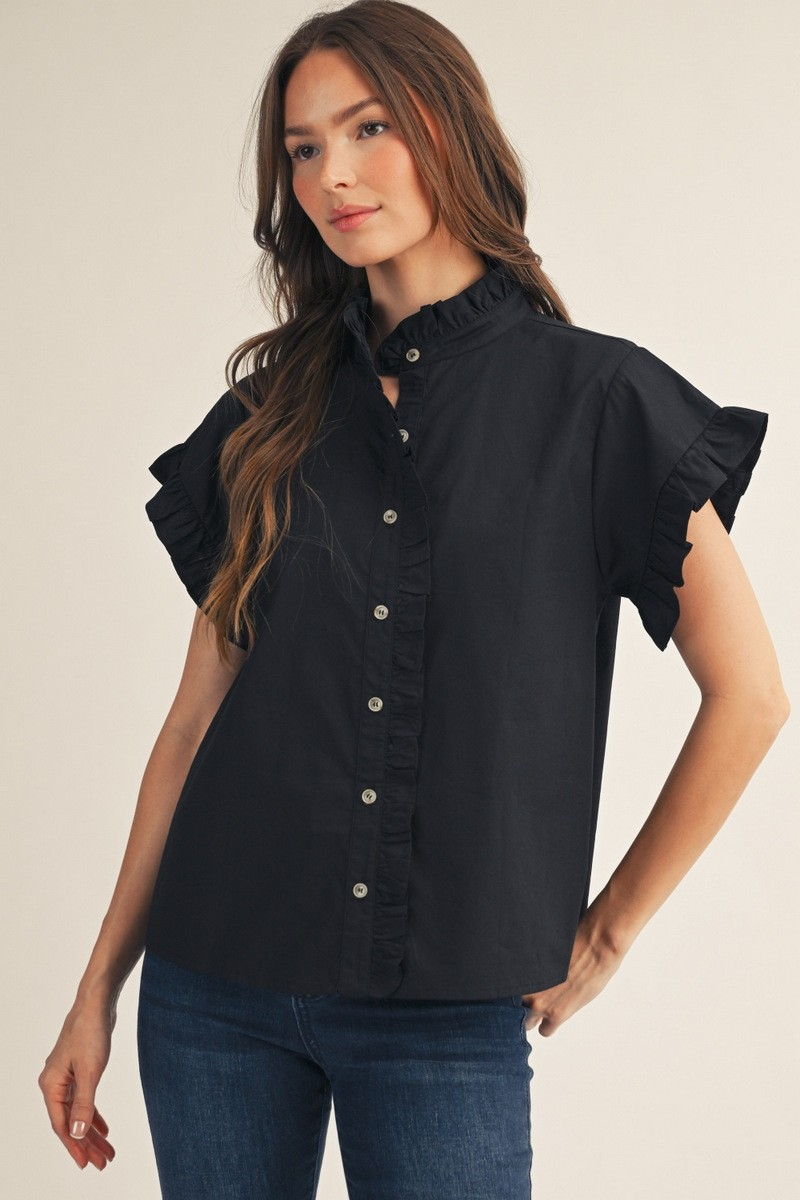 Woman wearing the Elise Ruffled Detail Woven Top in black with short ruffle sleeves and a high neck.