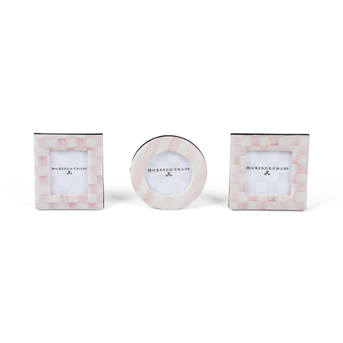Set of three pink and white patterned fabric photo frames in square, round, and rectangular shapes.