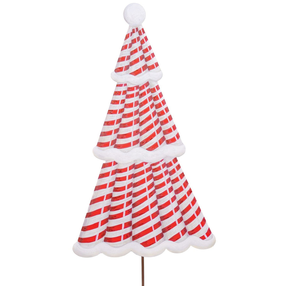 Red candy cane Christmas tree stake with white stripes on a green background.