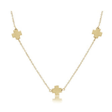Gold-filled choker necklace featuring a signature cross pendant on an adjustable chain.