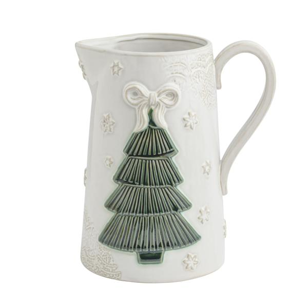 White stoneware pitcher with a green pressed Christmas tree design and a white bow accent.