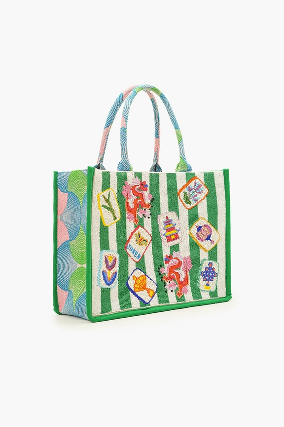 Large hand-beaded book tote with green and white stripes and colorful mahjong-themed illustrations.
