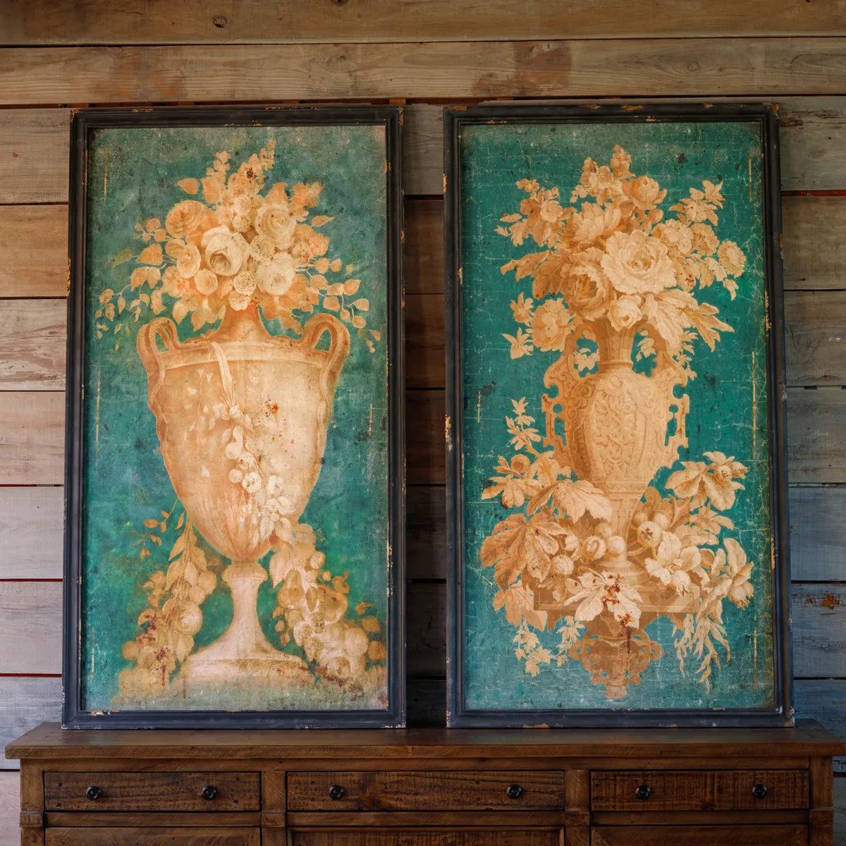 Framed floral art print showing a botanical illustration with green leaves on white paper.