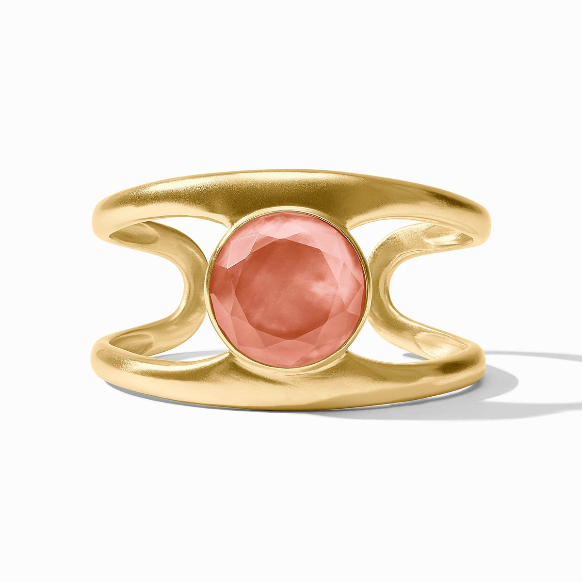 Gold Laguna Stone Cuff featuring a large, round, faceted pink stone in a bezel setting.