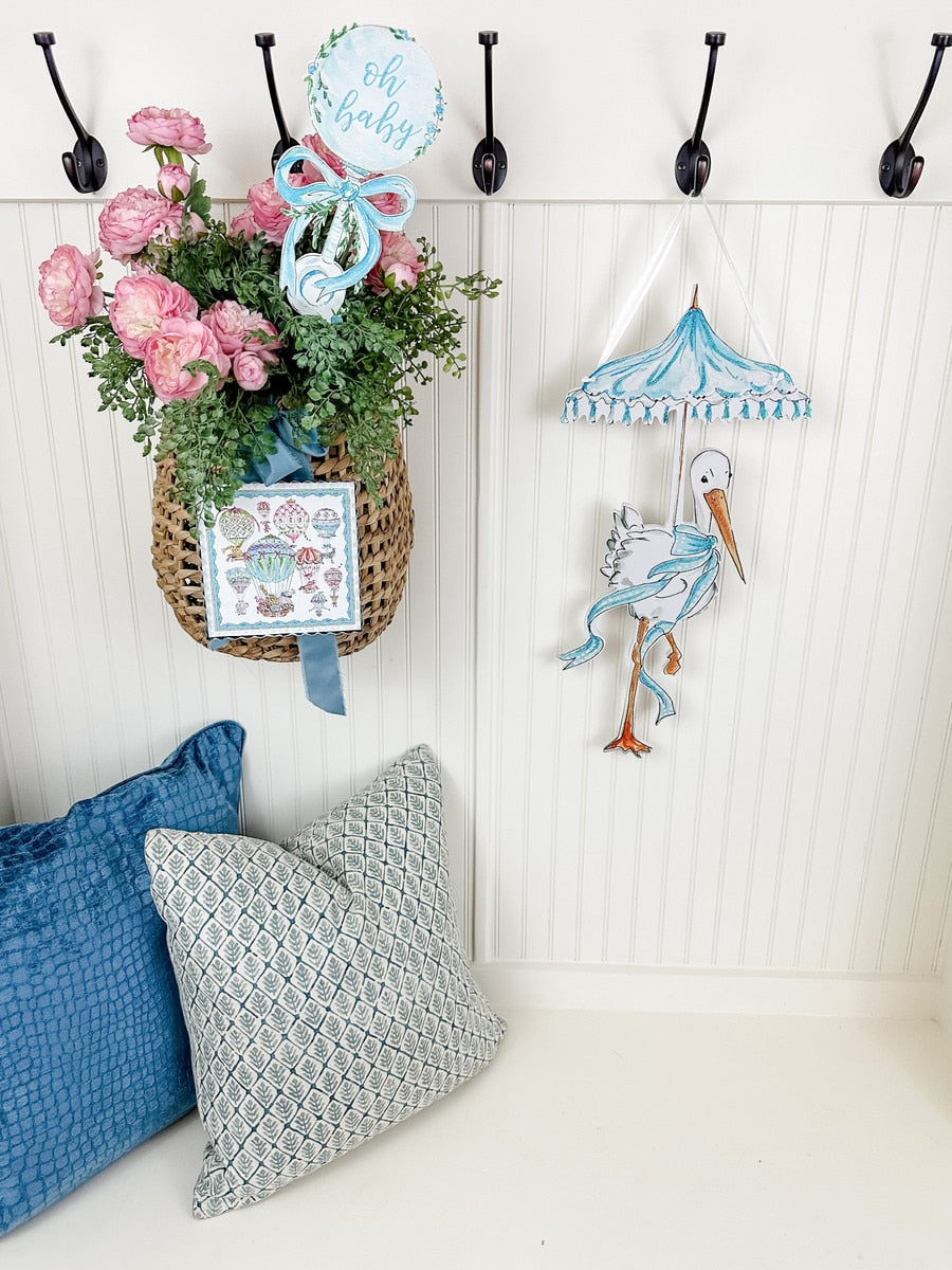 Beck's Stork Door Hanger in white ceramic with a black stork silhouette and hanging loop.