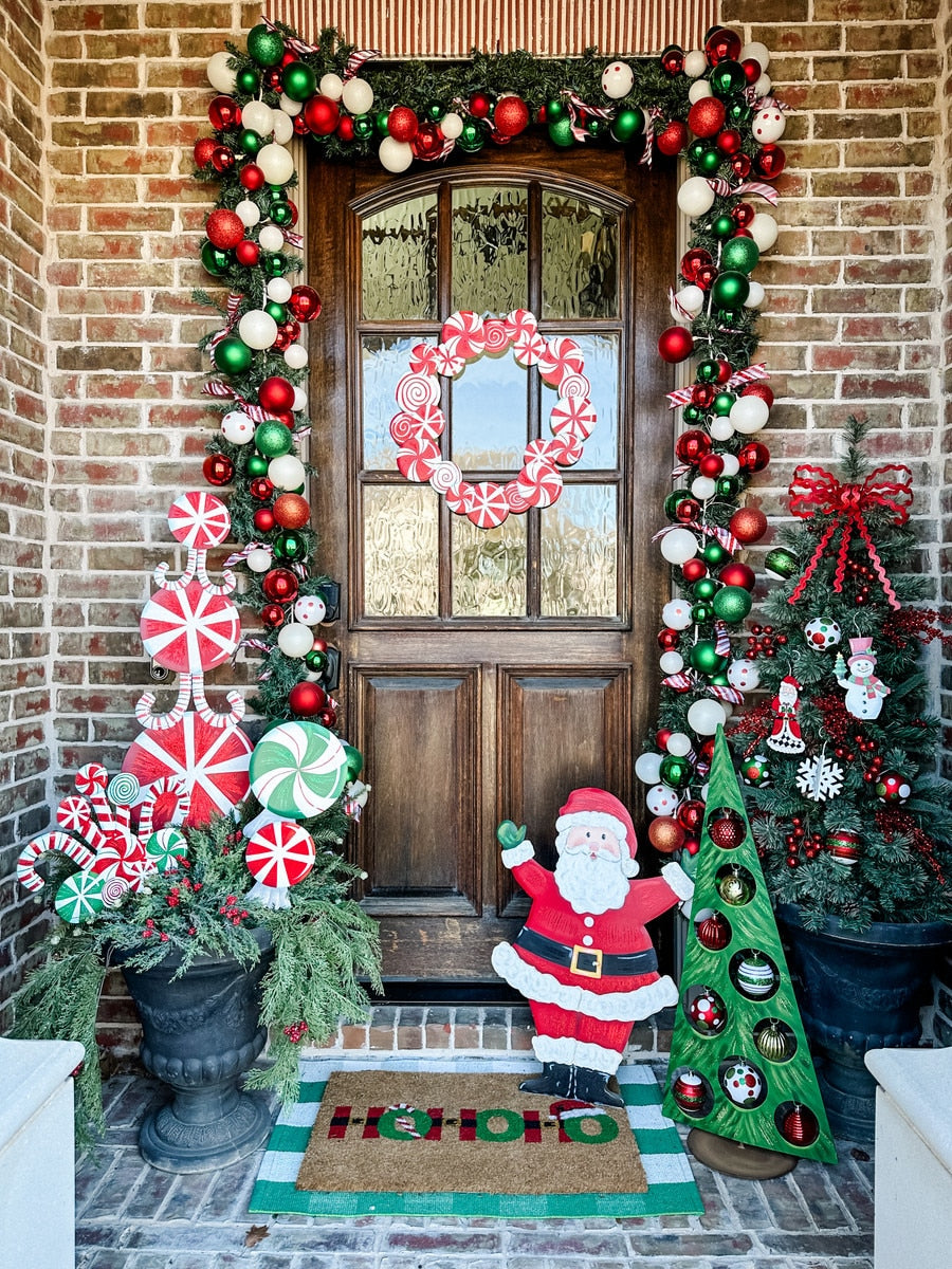 Holiday candy wreath with red and green striped candies arranged in a circular silhouette.