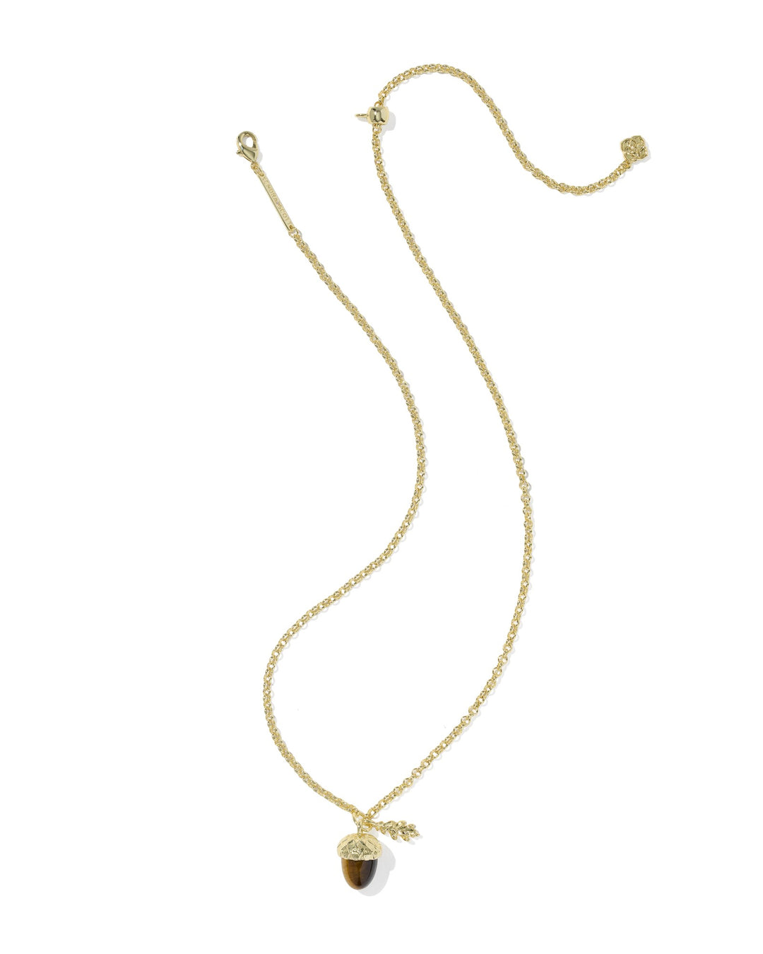 Gold chain necklace with a tiger's eye acorn pendant and a small gold leaf charm.