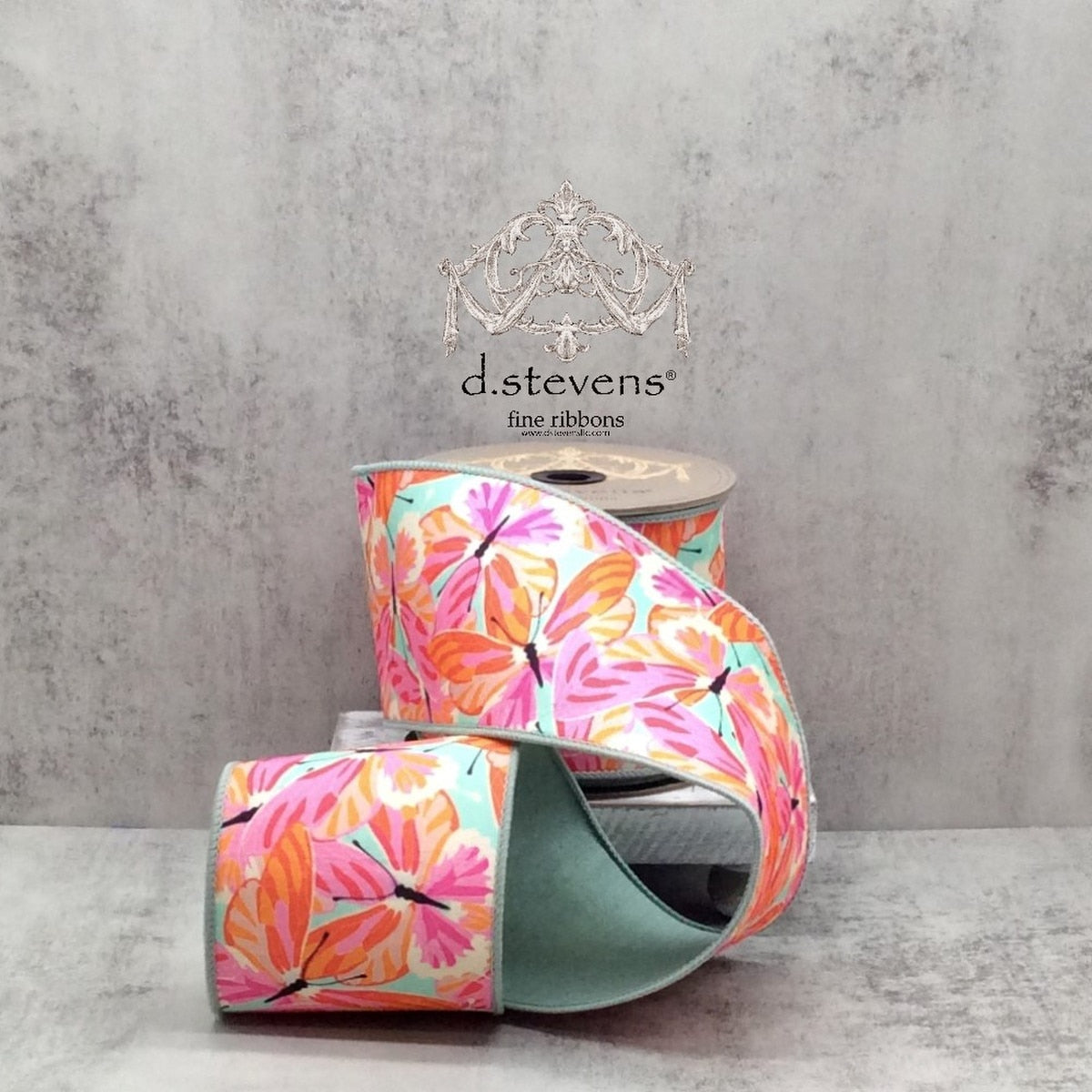 Ten yards of Dupion ribbon featuring colorful orange hot pink butterflies on a celadon background.