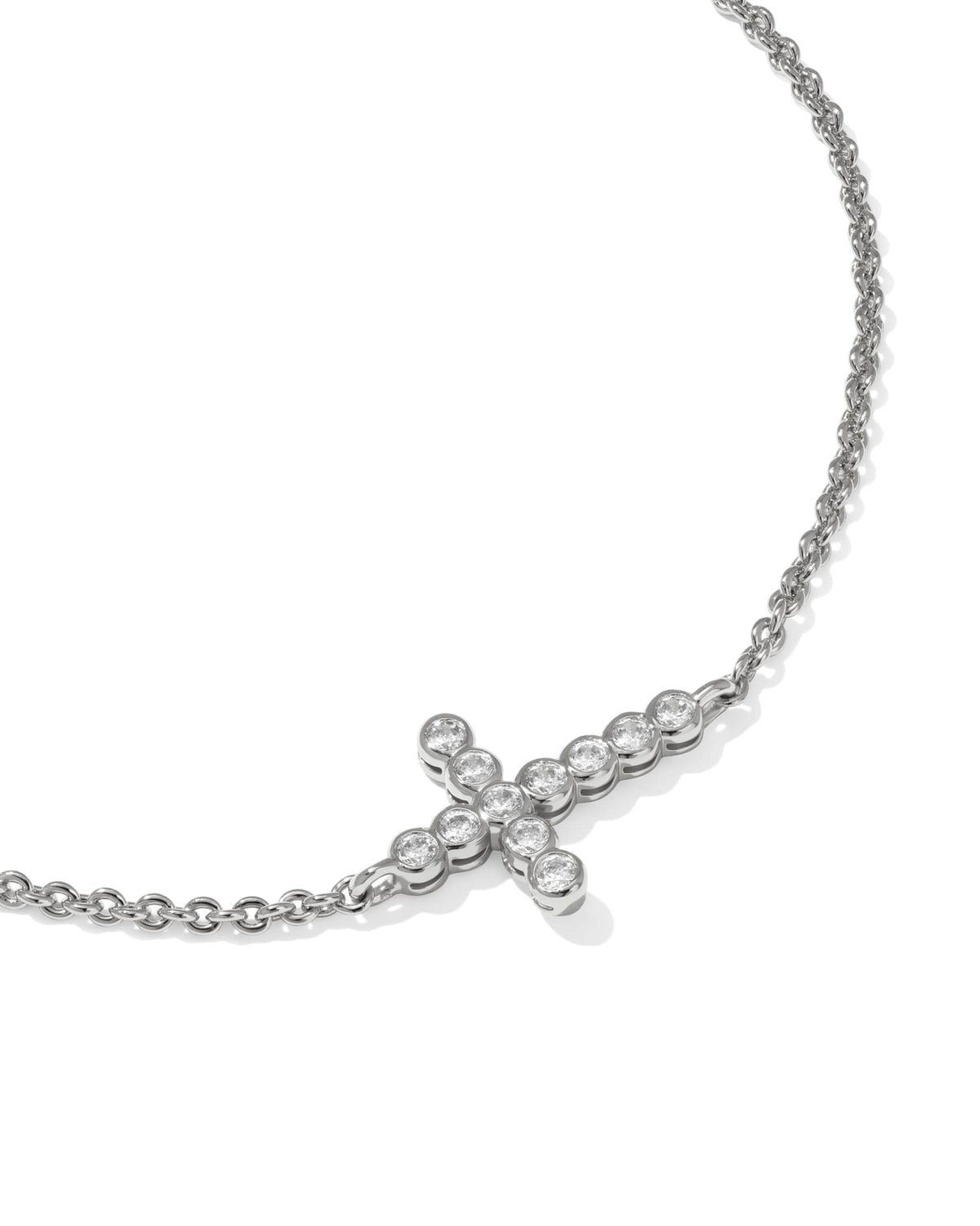 Delicate rhodium chain bracelet with white cubic zirconia cross pendant