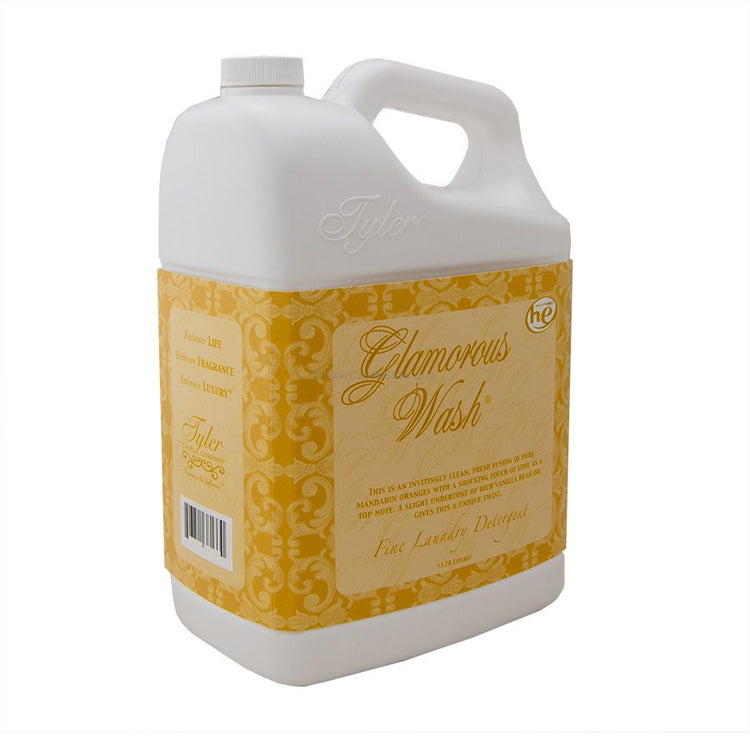A 3.78L white plastic jug of Tyler Glamorous Wash laundry detergent with a yellow patterned label.