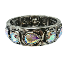 Silver metal stretch bracelet featuring round and teardrop rhinestones with a two-inch diameter.