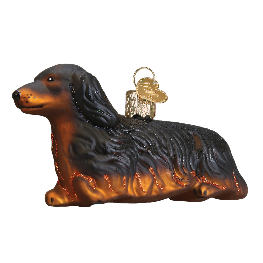 Long-haired Dachshund glass Christmas ornament in black and tan with glitter accents.