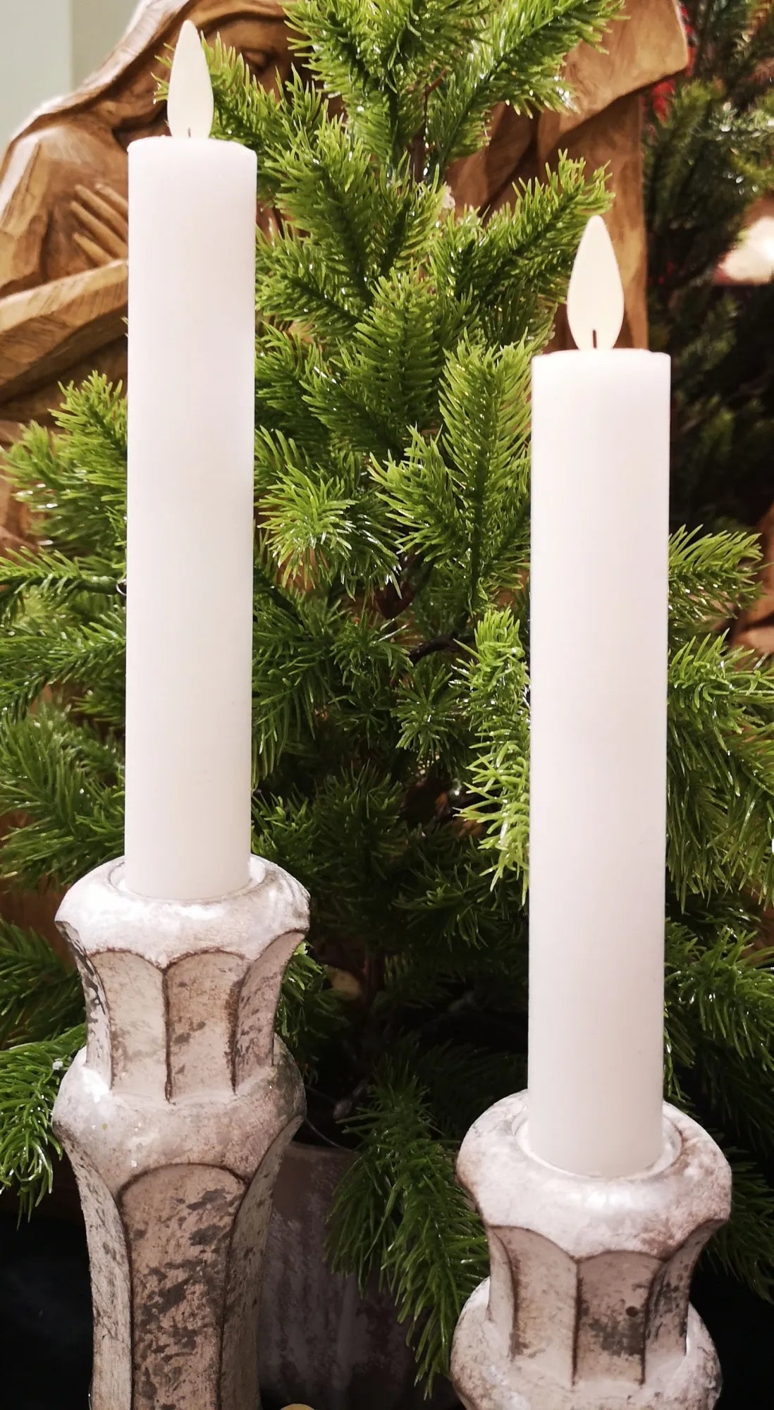 Set of three unscented LED taper candles with realistic moving flames in a warm white finish.