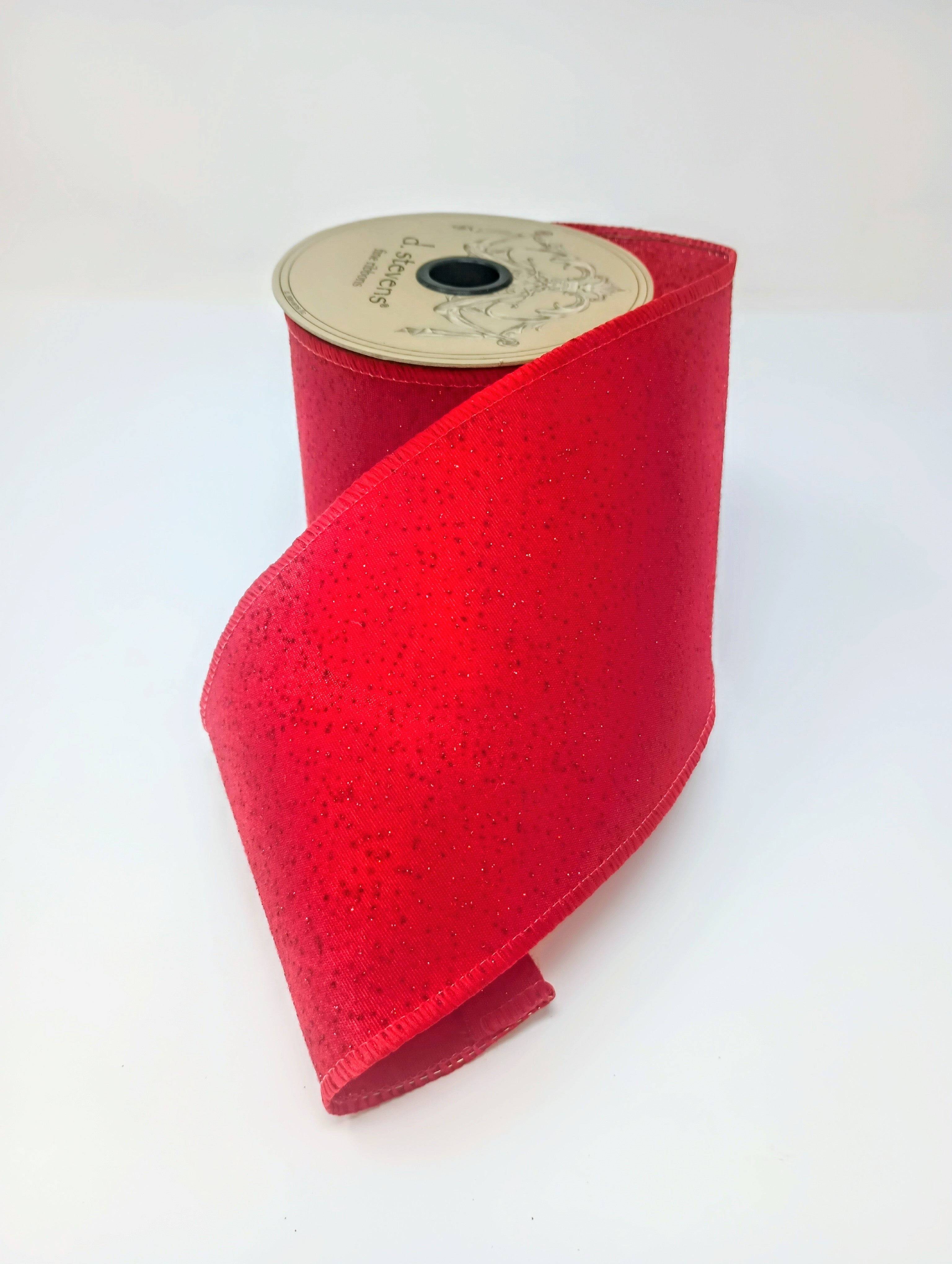Spool of 4-inch red faux glitter linen ribbon with wired edges.