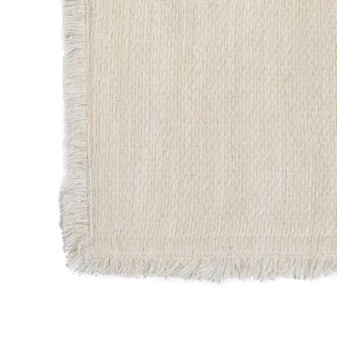 Gold ivory cotton shimmer table runner with fringed edges in a minimalist neutral shade.