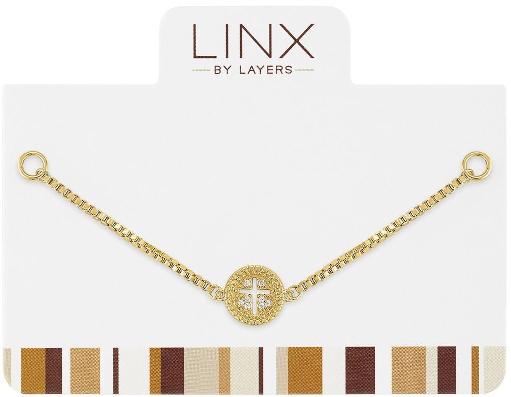 Gold cut-out cross charm on a sleek link designed as an add-on for LINX bracelets.