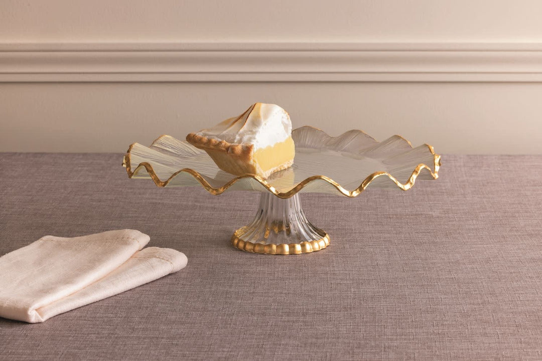 Glass cake stand with gold foil ruffle edge on a pedestal base