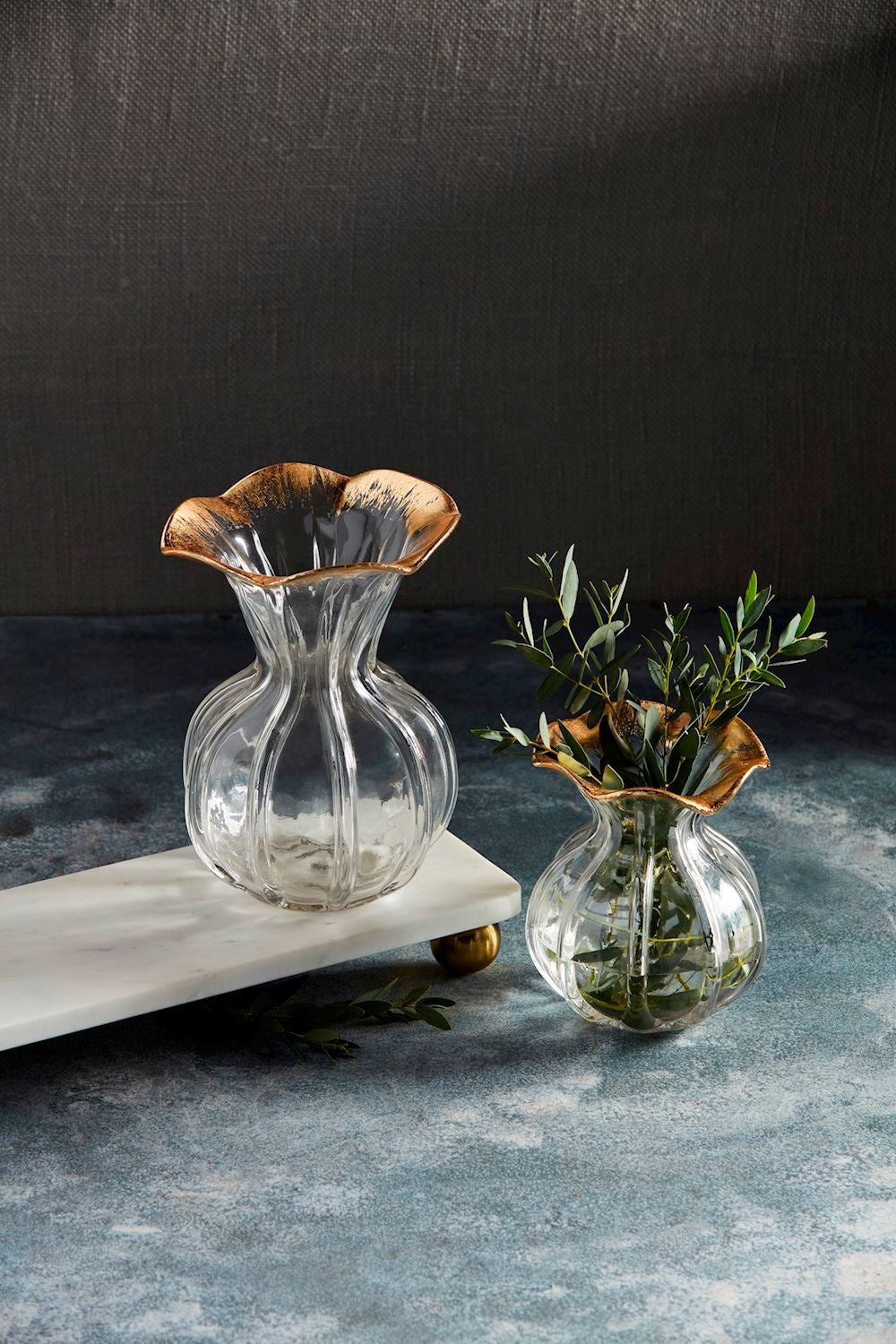 Hand-painted glass vase with a gold ruffle rim on a fluted silhouette.