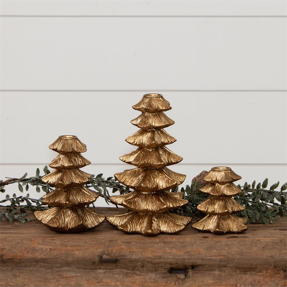 Gold finish resin candle holder shaped like a Christmas tree with iron accents