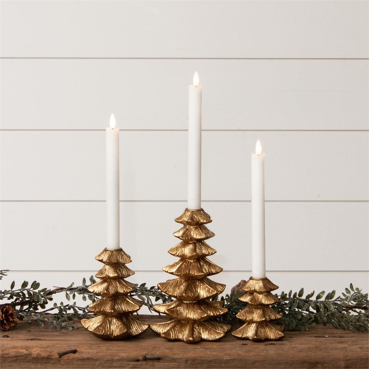 Gold finish resin candle holder shaped like a Christmas tree with iron accents