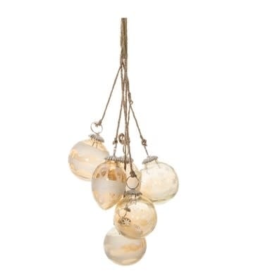 Gold glass ornament drop with jute accents on a garland