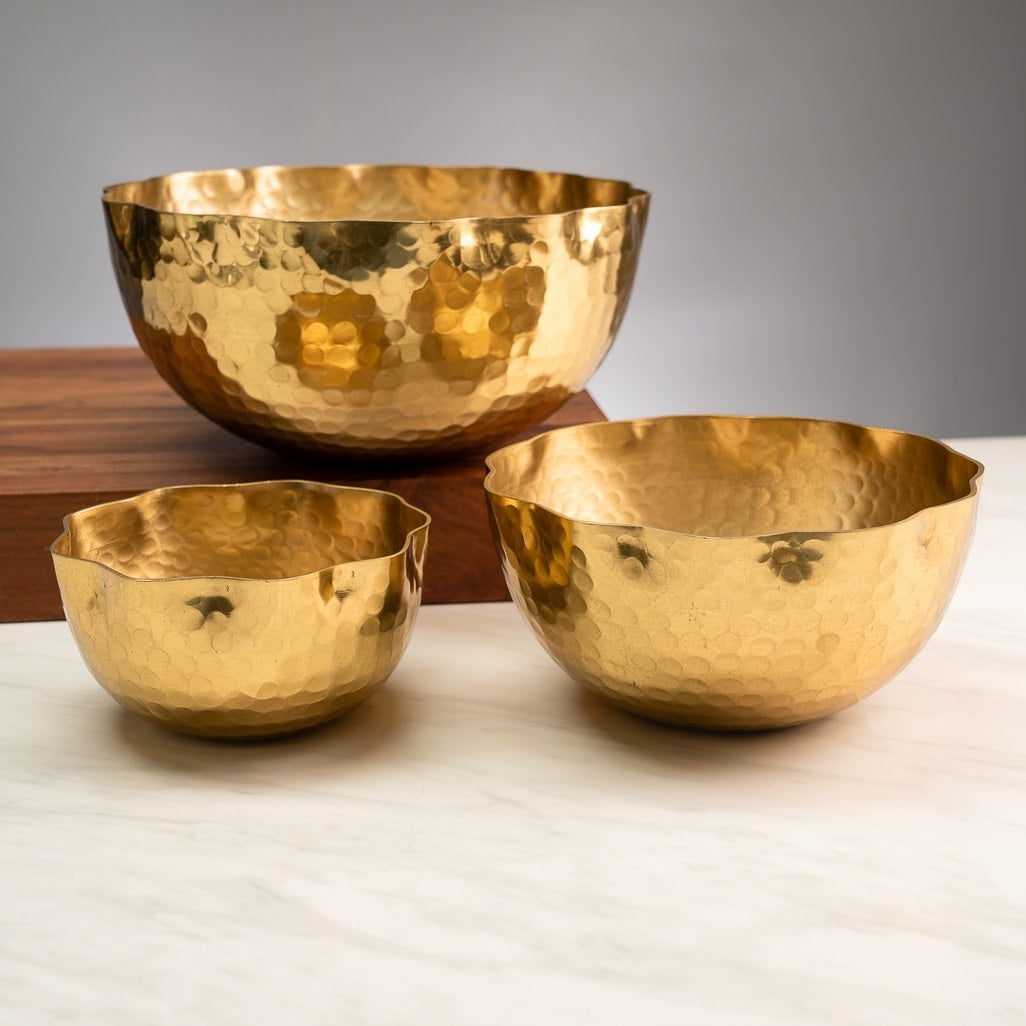 Gold hammered aluminum petal bowl with an eight-inch diameter.