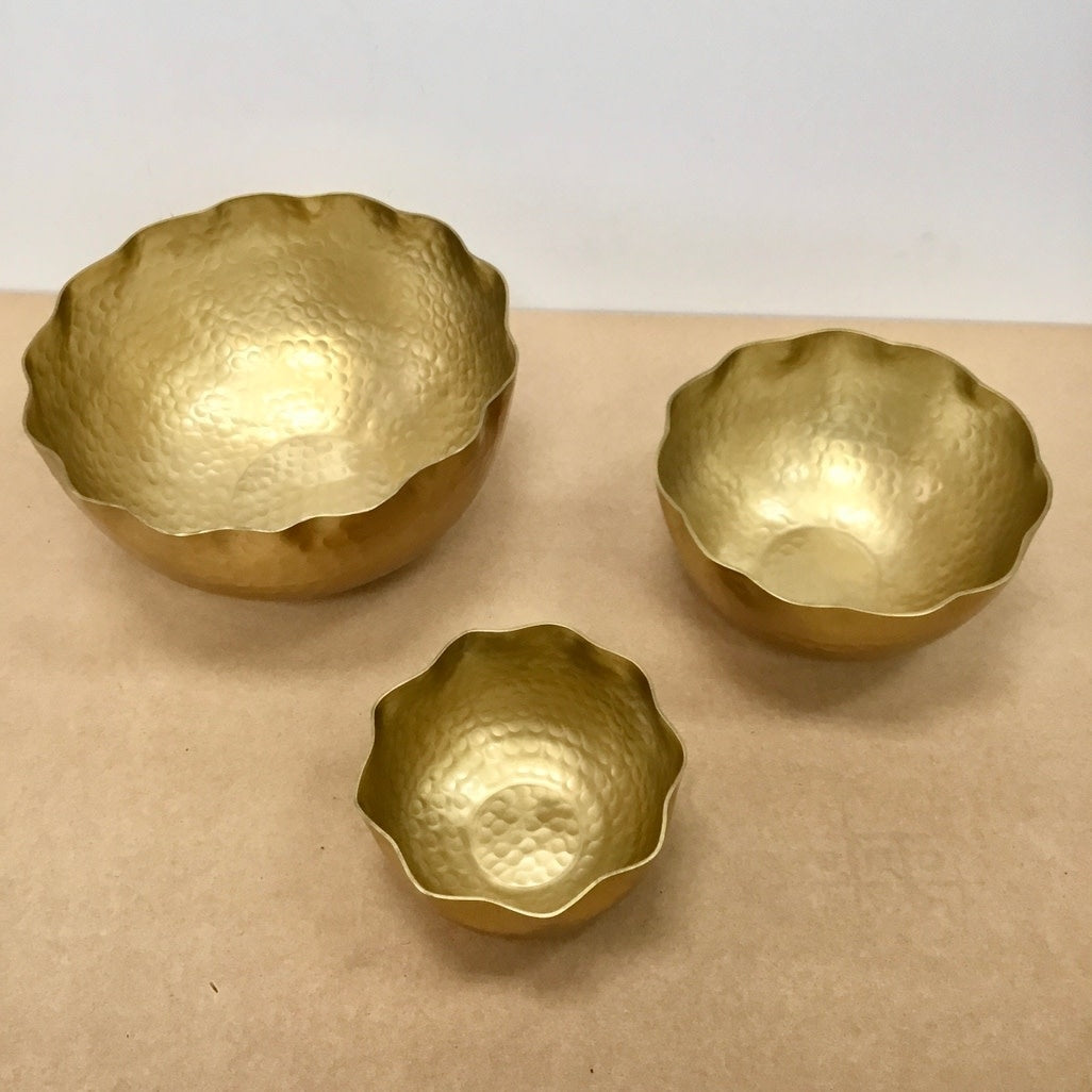 Gold hammered aluminum petal bowl with an eight-inch diameter.