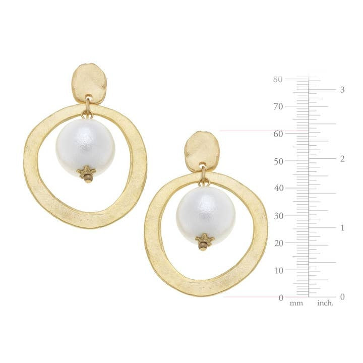 Gold hoop earrings featuring a white cotton pearl accent